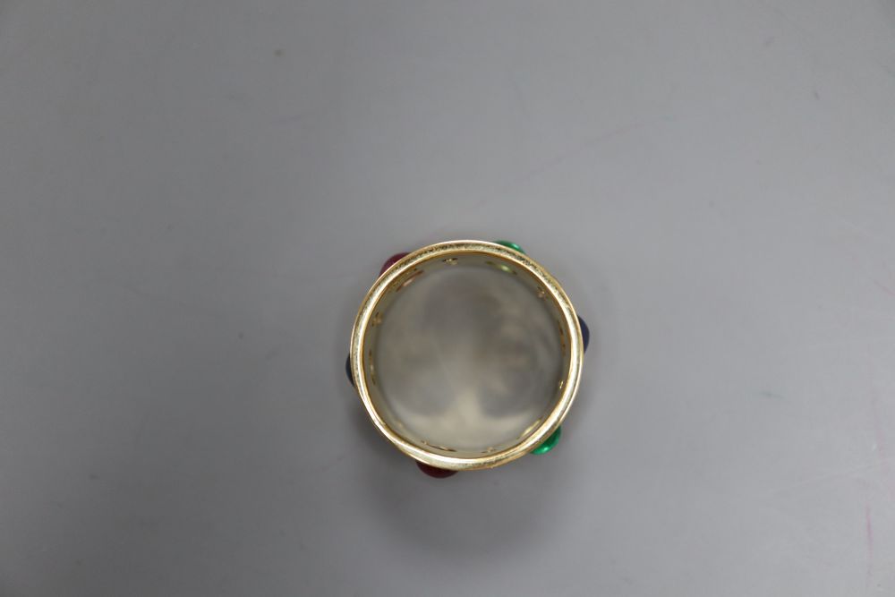 A modern yellow metal, diamond and cabochon ruby, sapphire and emerald set band, signed Alex, size S, gross 11.4 grams.